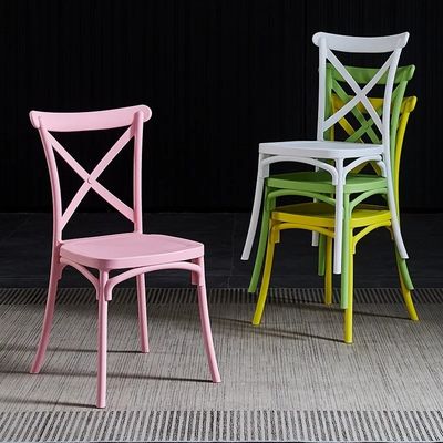 kopen Hotel Huwelijk PP Roze Plastic Eetstoelen Stapelbare Aanpasbare X Kruis Achtersteun online vervaardiging